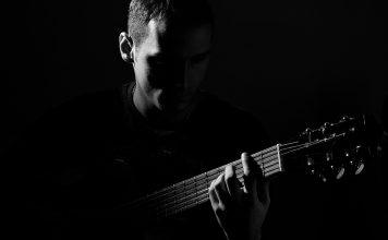 Guitar Lessons for Beginners – Start Strumming Today! Guitarist Black